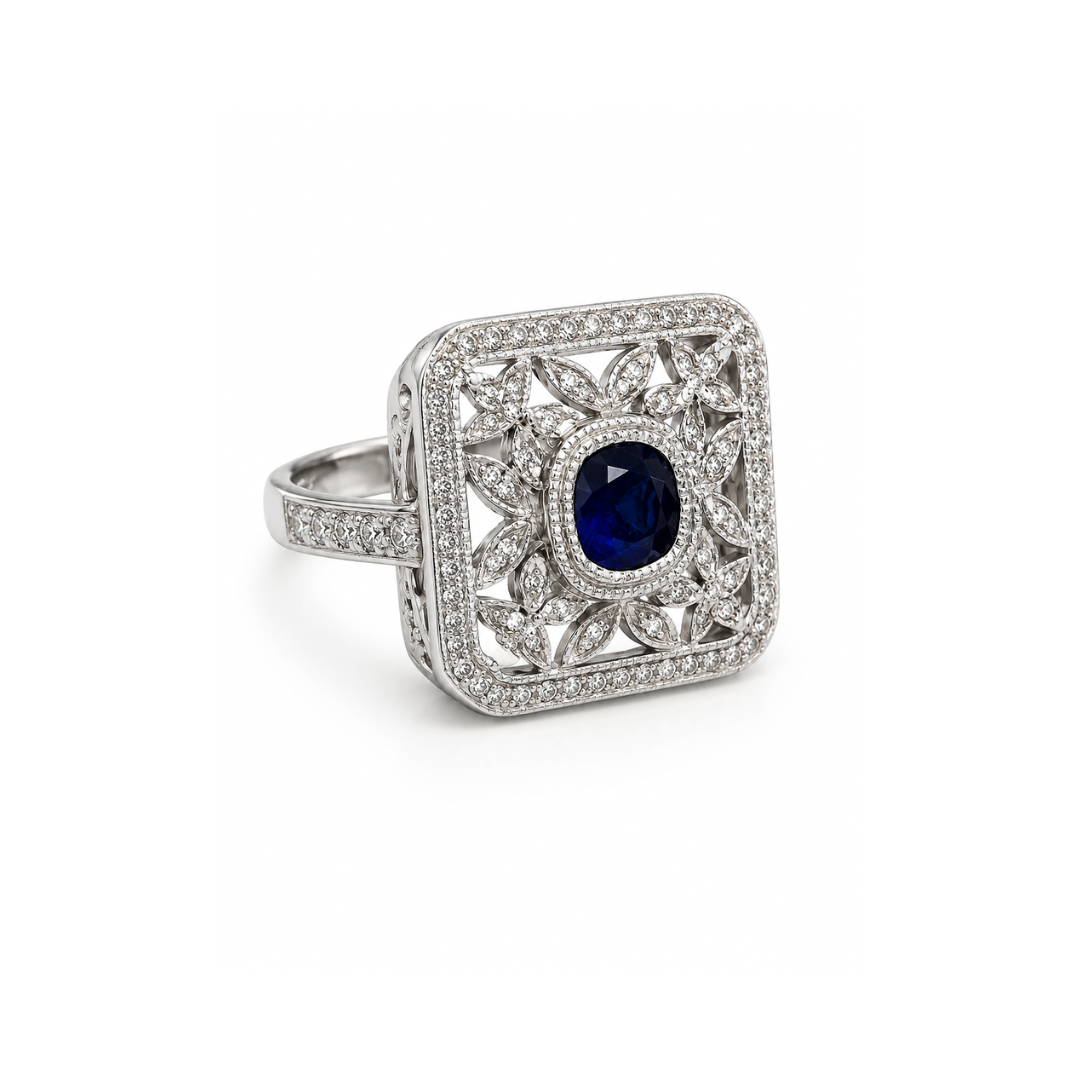 Anillo de Oro Blanco Brillantes y Zafiro Cushion.